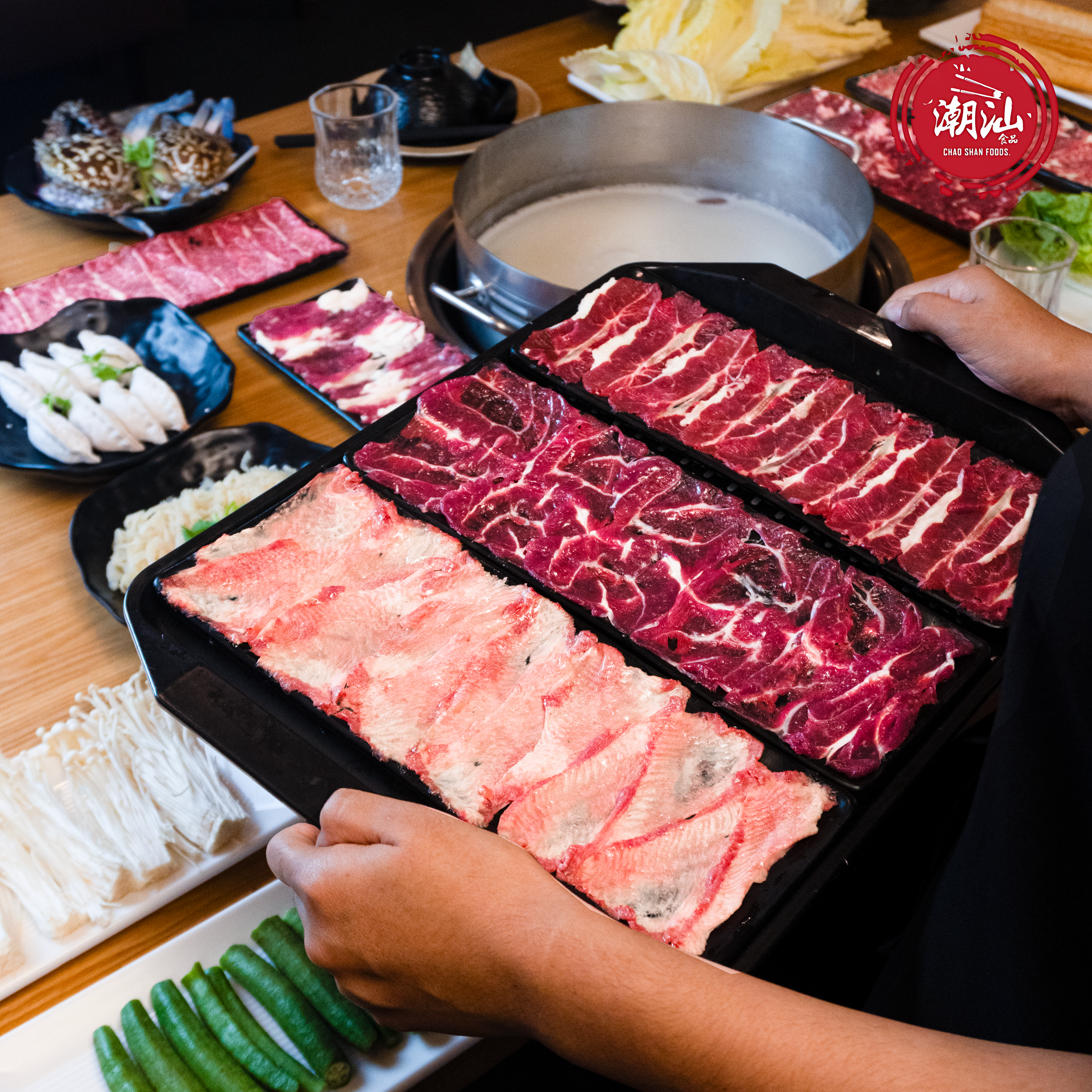 Restaurant creative showing beef slices cooking in a hotpot